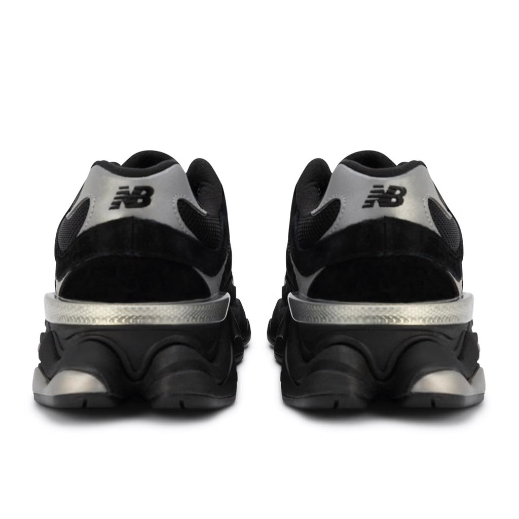 Black and silver New Balance sneakers on a white background