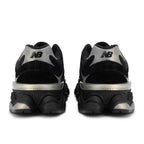 Black and silver New Balance sneakers on a white background