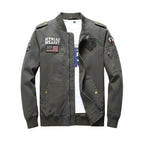 Green jacket with patches on a wooden surface