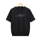 Black t-shirt with white airplane design on a hanger in a clothing store.